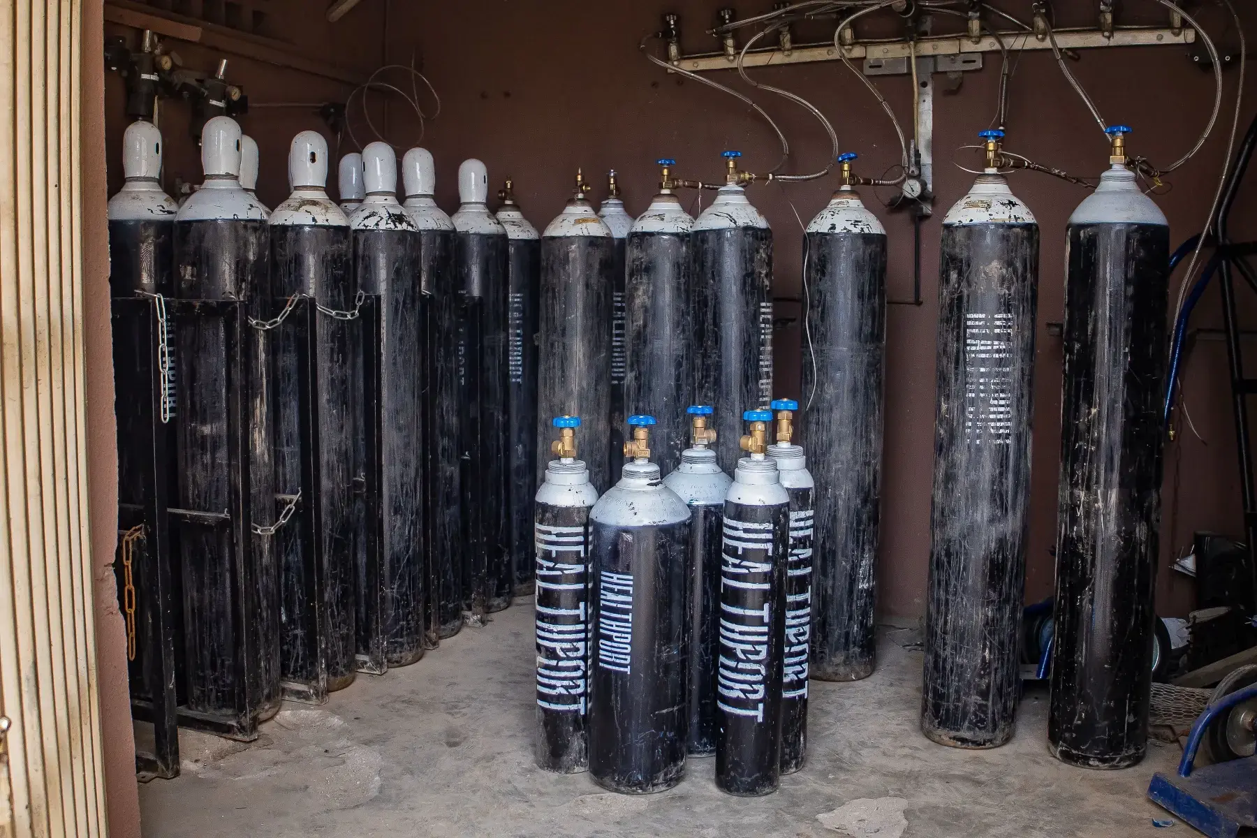 Rack of filled HealthPort cylinders at the depot