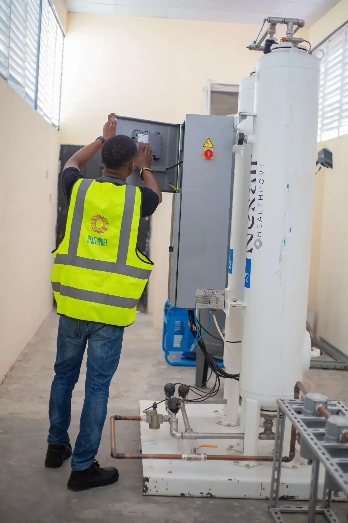 Technician commissioning the Nexair plant control panel